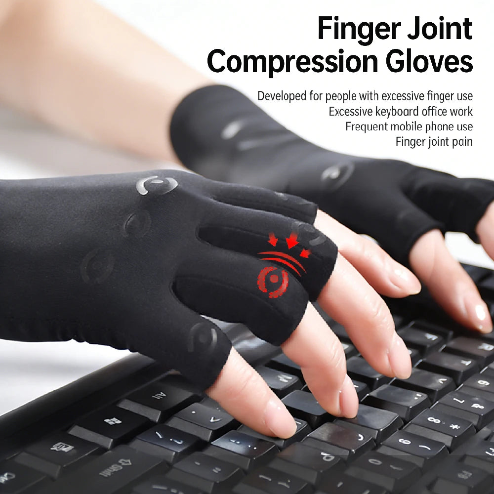 Black finger joint compression gloves being worn on a hand typing on a laptop keyboard.