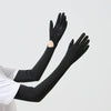 Black UPF 50+ sun protection arm sleeves worn on an arm.