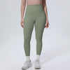 A model wearing olive green high-waisted quick-drying yoga and fitness leggings and white socks.