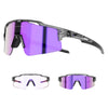 A pair of purple photochromic cycling sunglasses with black frames and UV400 protection.