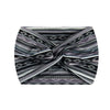 A close-up of a grey and black striped boho printed wide knotted headband.
