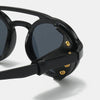Black retro steampunk goggles sunglasses with gold accents shown in a close-up view.