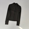 A black quick-dry yoga and fitness jacket shown flat lay.