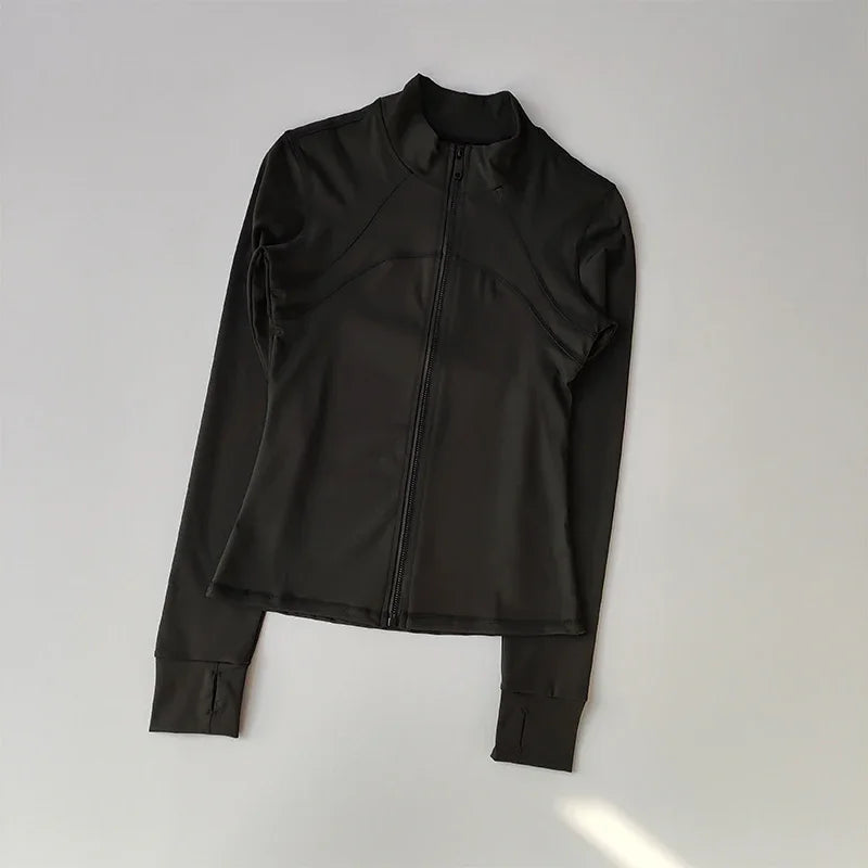 A black quick-dry yoga and fitness jacket shown flat lay.