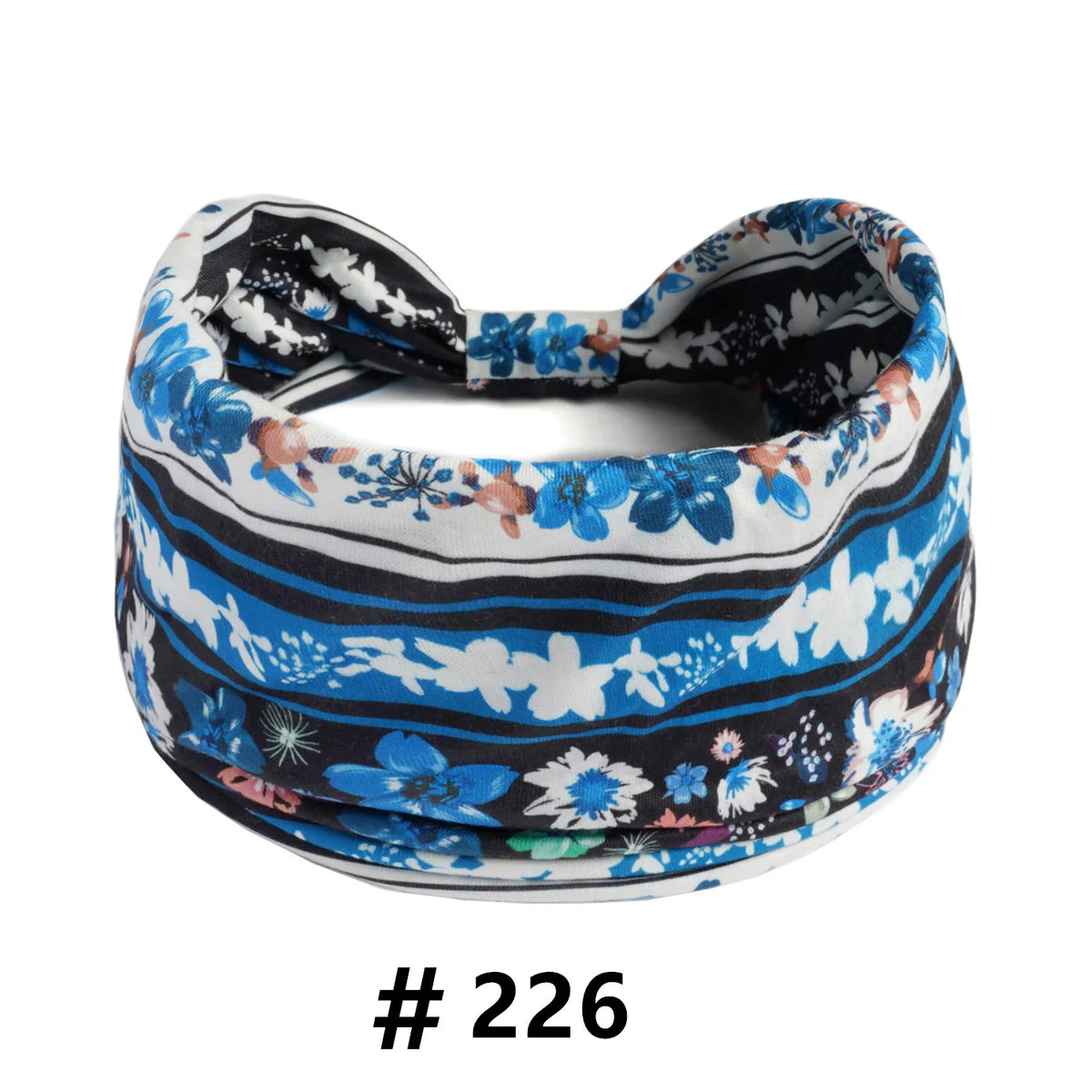A patterned fabric turban headband featuring blue, white, and black floral designs.