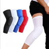 A set of various colored compression knee pads for sports and gym, shown on a leg.