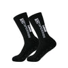 A pair of black anti-slip performance sports socks shown from the side.
