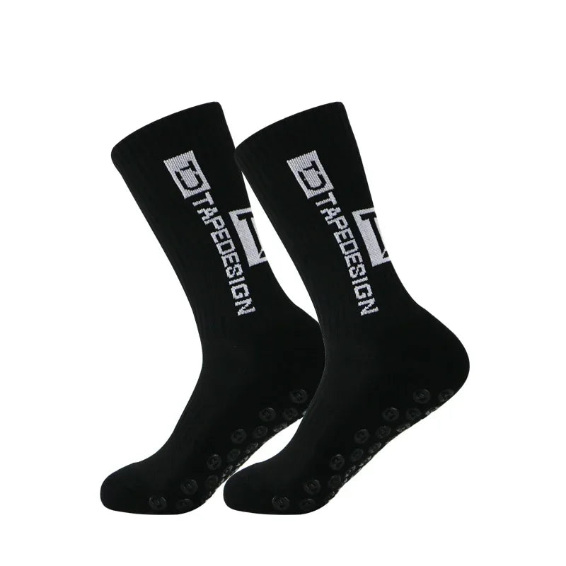 A pair of black anti-slip performance sports socks shown from the side.