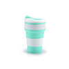 A reusable silicone collapsible coffee cup with a lid in white and mint green stripes.