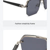 A pair of gray-tinted aviator sunglasses with a fashion simplicity frame and smooth hinge.