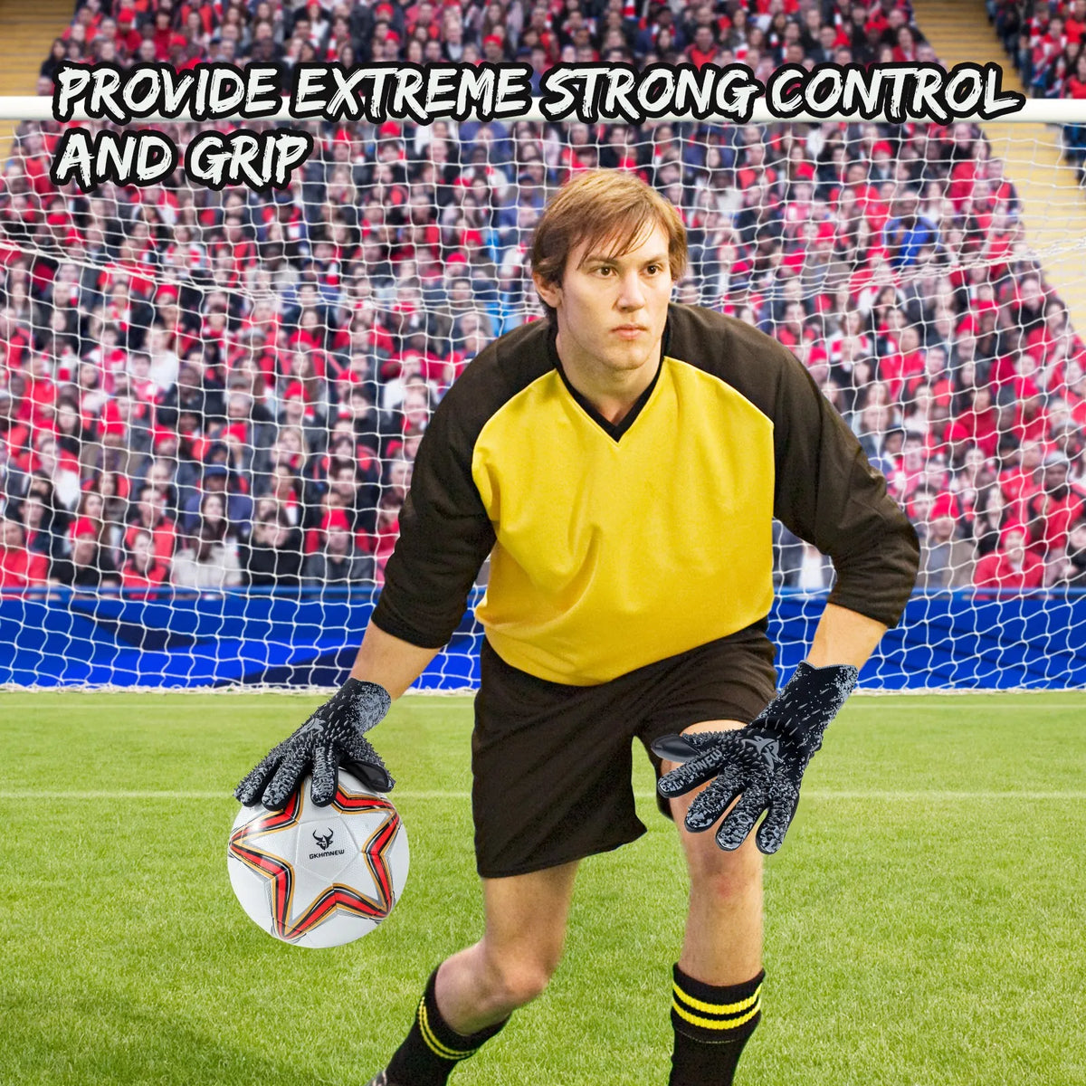 A male soccer goalkeeper wearing black uniform and black gloves is positioned on a green field with a soccer ball.