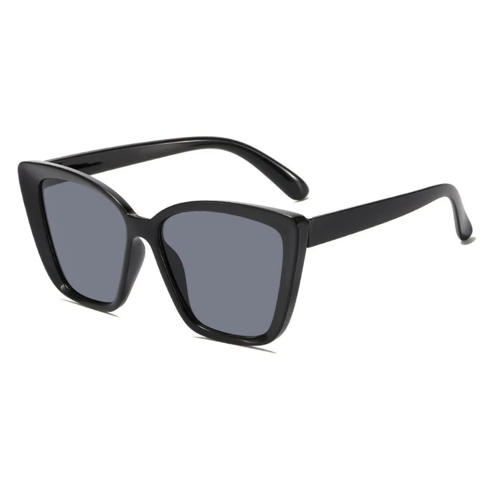 Black cat eye vintage sunglasses with gradient lenses shown against a white background