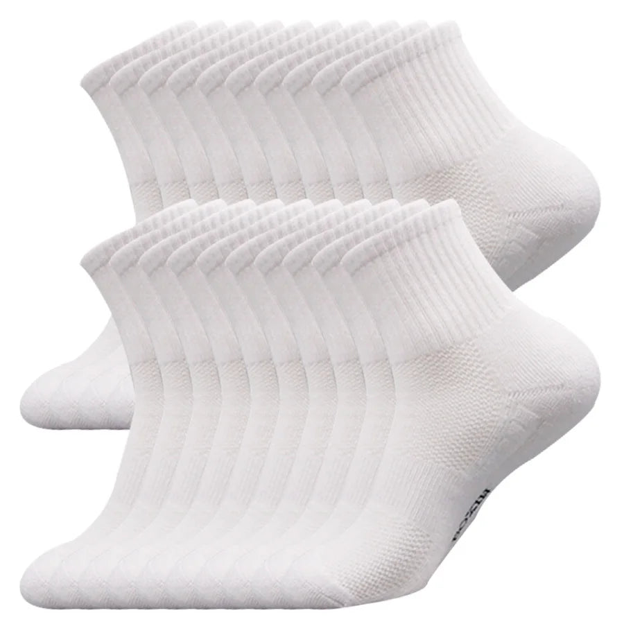 A stack of white men's essential warm socks for outdoor activities