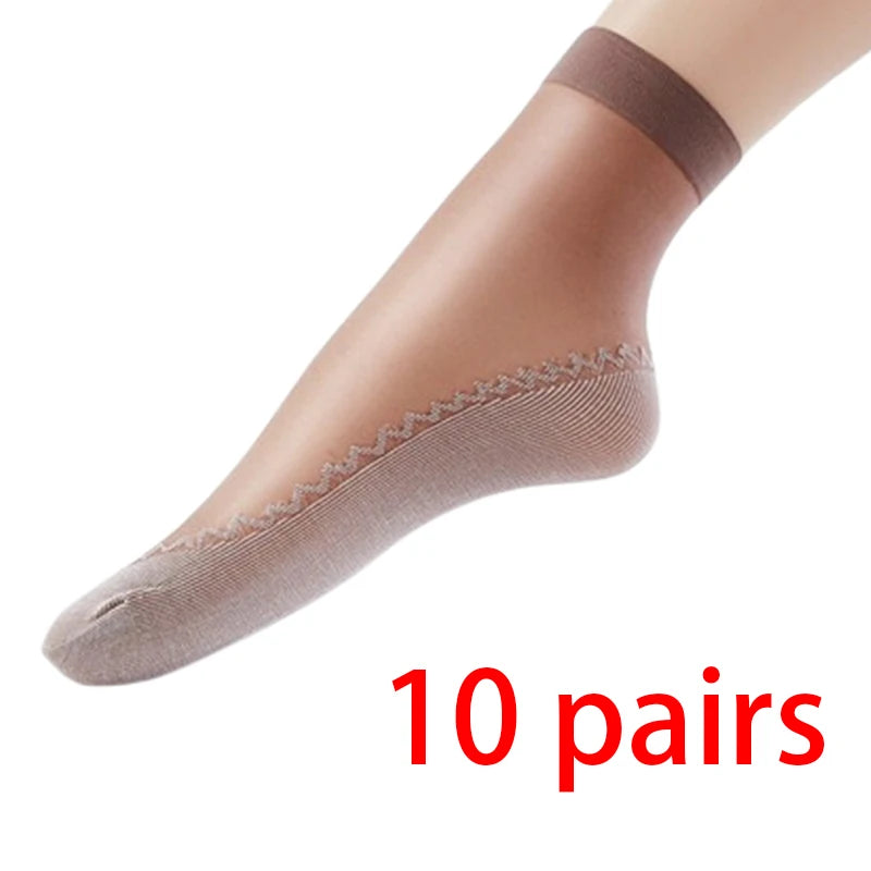 A pair of tan ankle socks shown on a foot, ready for sale.