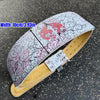 A beige weightlifting belt featuring a white and pink dragon design on the outer surface.