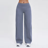 A pair of slate gray high-waist flared yoga pants being worn by a person.