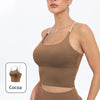 A model wearing a brown summer strappy yoga sports bra with built-in padding.