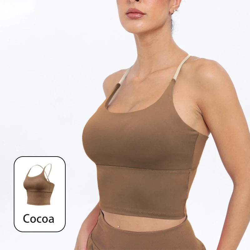 A model wearing a brown summer strappy yoga sports bra with built-in padding.