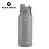 A gray insulated stainless steel thermal water bottle with a silver cap.