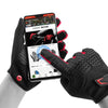 A close-up of black cycling gloves being worn on a hand, with a smartphone displaying instructions.