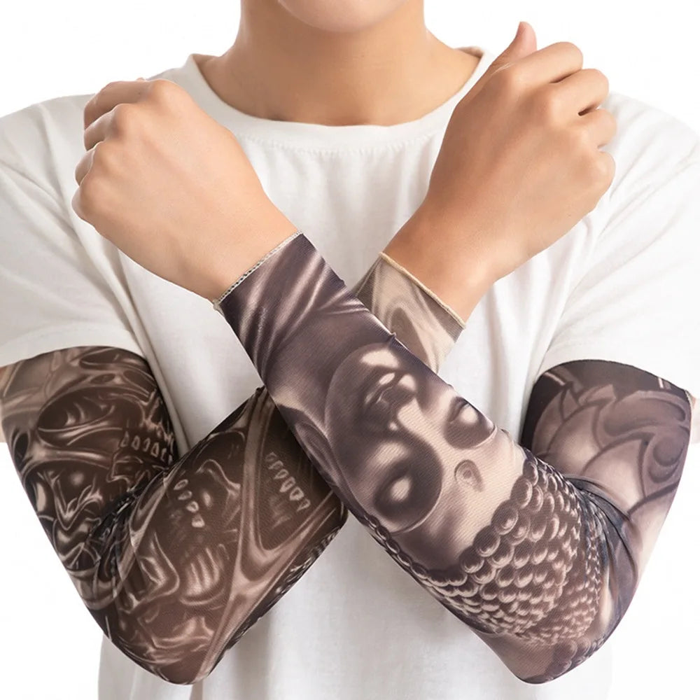 A person is wearing brown patterned UV protection tattoo arm sleeves on their arms.