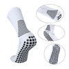 White performance football socks featuring black stripes and polka dots on the ankle and foot.