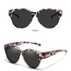 Brown and white patterned round sunglasses shown from the front and at a 45-degree angle.