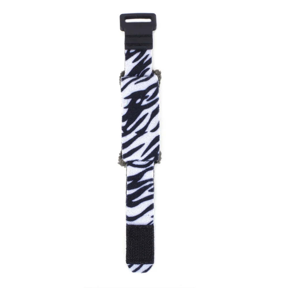 Black and white striped damper tape with a black clip for string noise reduction
