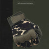 A close-up view of dark tactical gloves with a camouflage pattern and olive green accents.