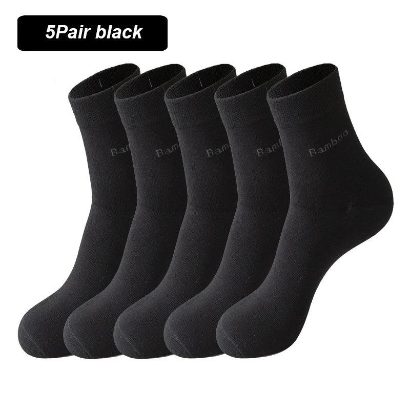 A stack of five black bamboo fiber socks shown from the side.