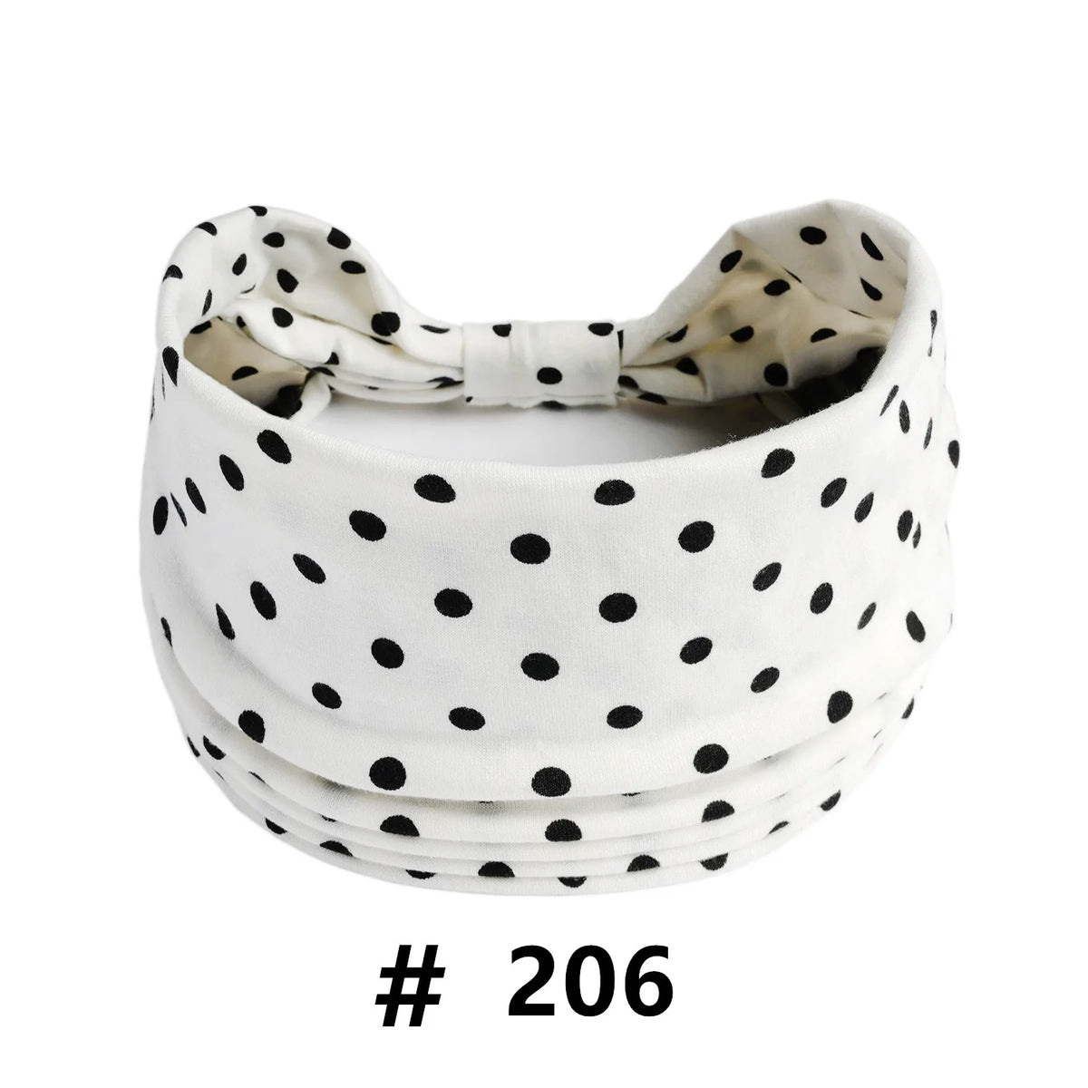 White fabric headband with black polka dots tied in a bow