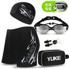 Black men's swim gear set including a cap, goggles, and earplugs