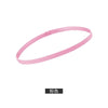 A pink elastic silicone sports headband shown against a white background.