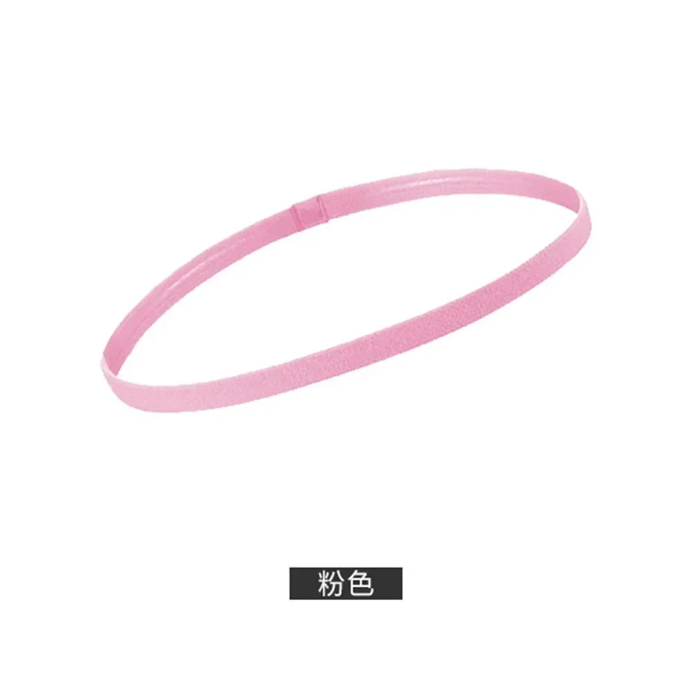 A pink elastic silicone sports headband shown against a white background.
