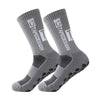 A pair of gray anti-slip performance sports socks shown from the side.