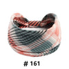 A rolled boho cotton turban headband featuring plaid patterns in shades of pink, gray, and black.
