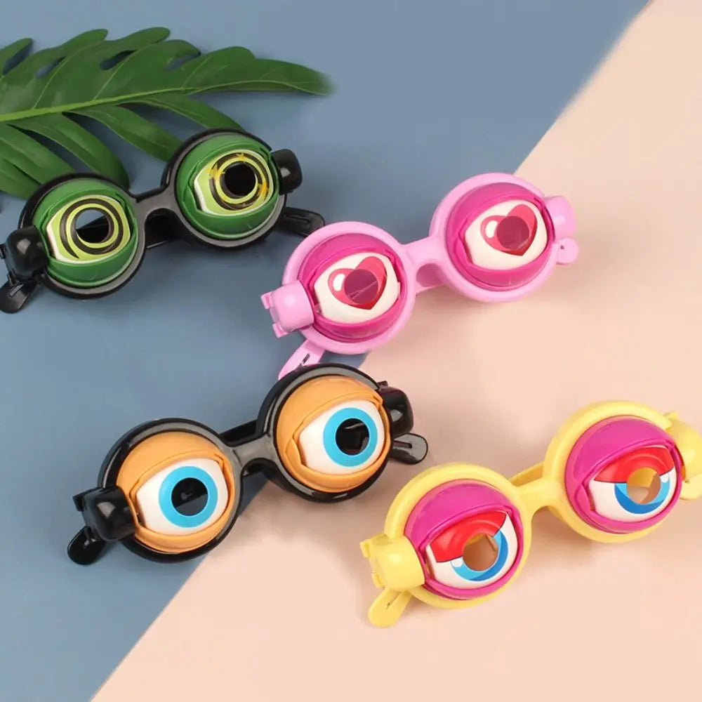 A collection of colorful novelty glasses featuring hearts and various eye designs on a light background.