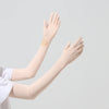 Light beige UPF 50+ sun protection arm sleeves worn on a person's arms.