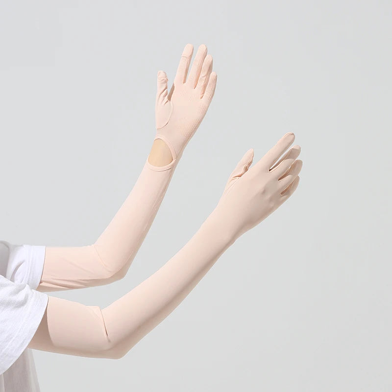 Light beige UPF 50+ sun protection arm sleeves worn on a person's arms.