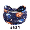 Navy blue knotted cotton headband featuring celestial designs like moons and suns