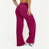 A model wearing high-waist magenta yoga pants from the side.