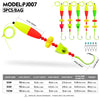A set of five colorful float rigs with attached hooks and line, demonstrating various float heights and hook sizes.