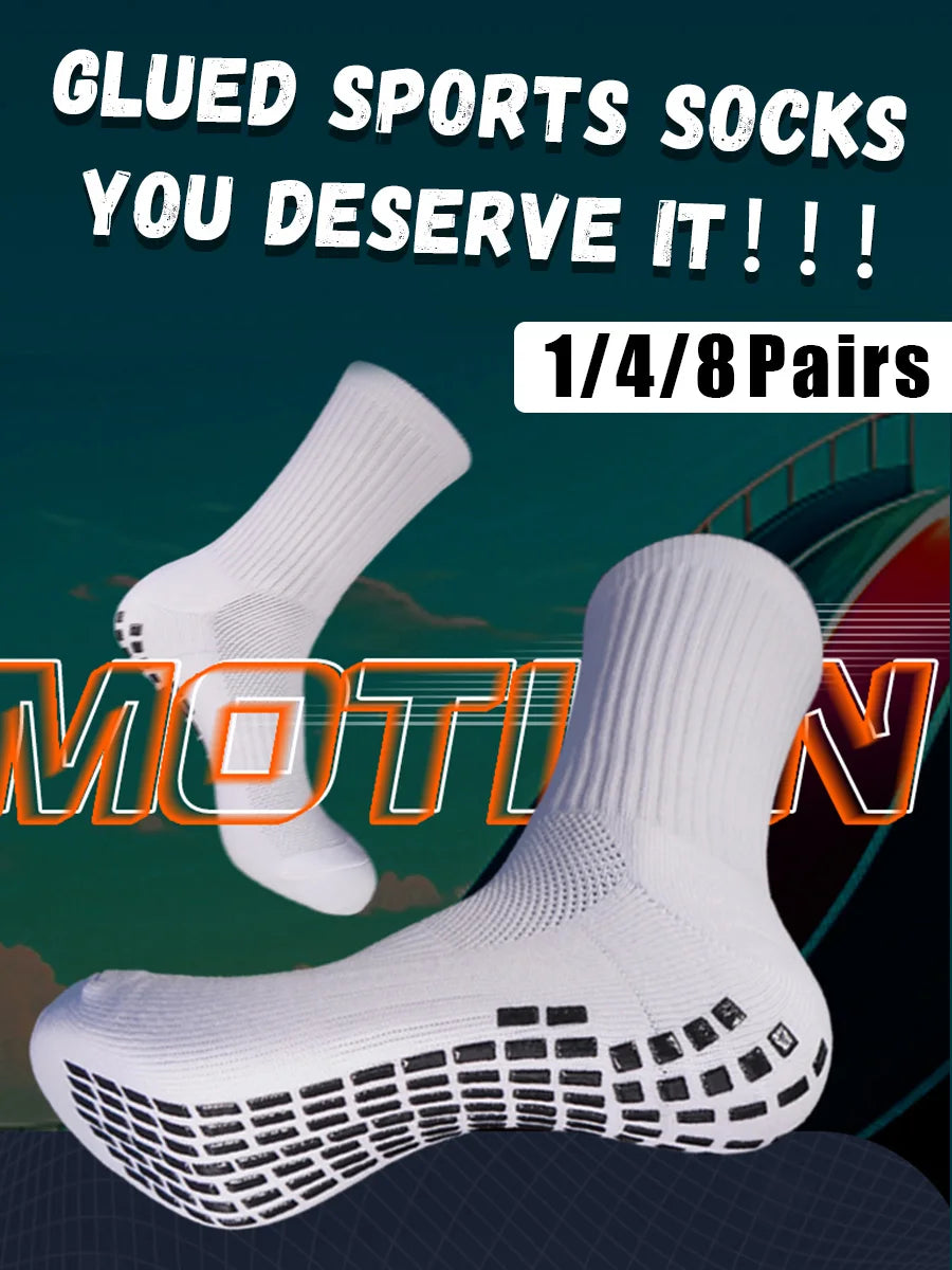 White athletic grip socks shown in a close-up, highlighting the sole design for sports performance.
