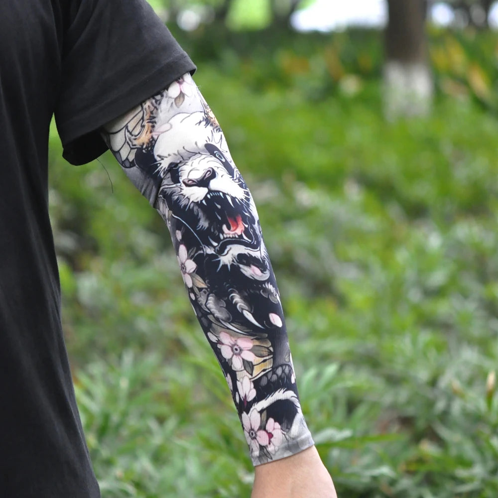 Close-up of a person wearing a long sleeve featuring a black and white tiger tattoo design.