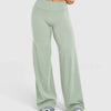 Light sage green high waisted wide leg yoga pants worn by a person.
