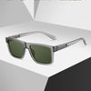 A pair of silver-framed, square sunglasses with green lenses displayed on a light gray background.