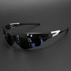 Black wraparound sports sunglasses with white accents resting on a dark surface.