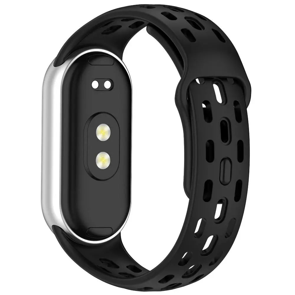 A black silicone smart watch band replacement with a silver casing and multiple holes for breathability.