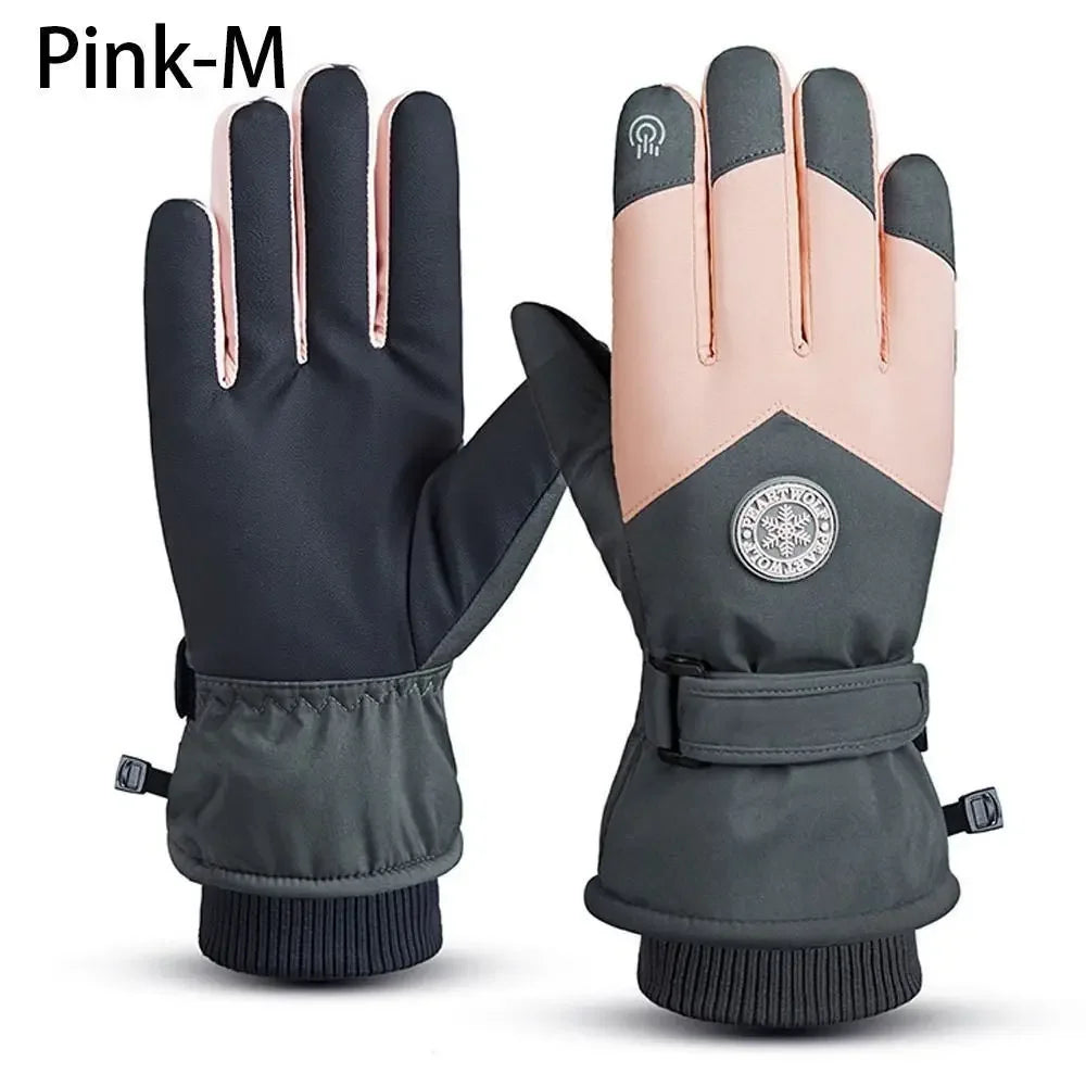 A pair of black and pink waterproof touchscreen ski gloves for winter sports