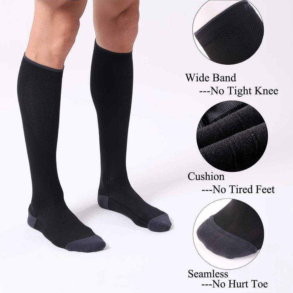 Black compression socks shown on a foot, with details highlighting wide band, cushion, and seamless features.